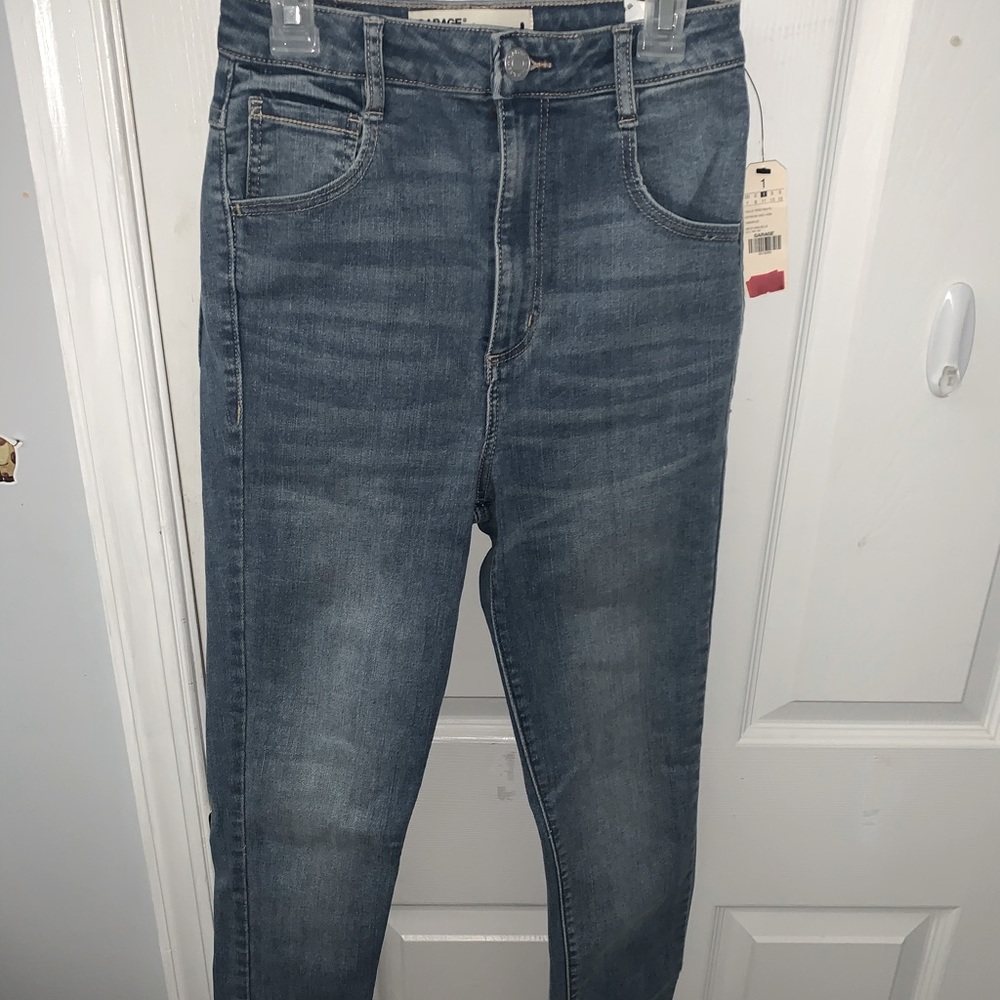 high rise jeans, size 1 and a faded blue.